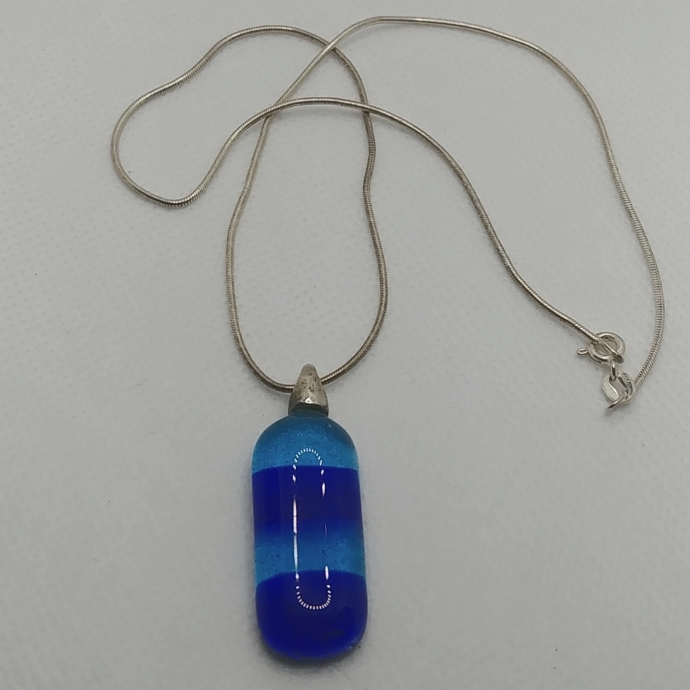 Fused Blue glass pendant on liquid 925 silver.